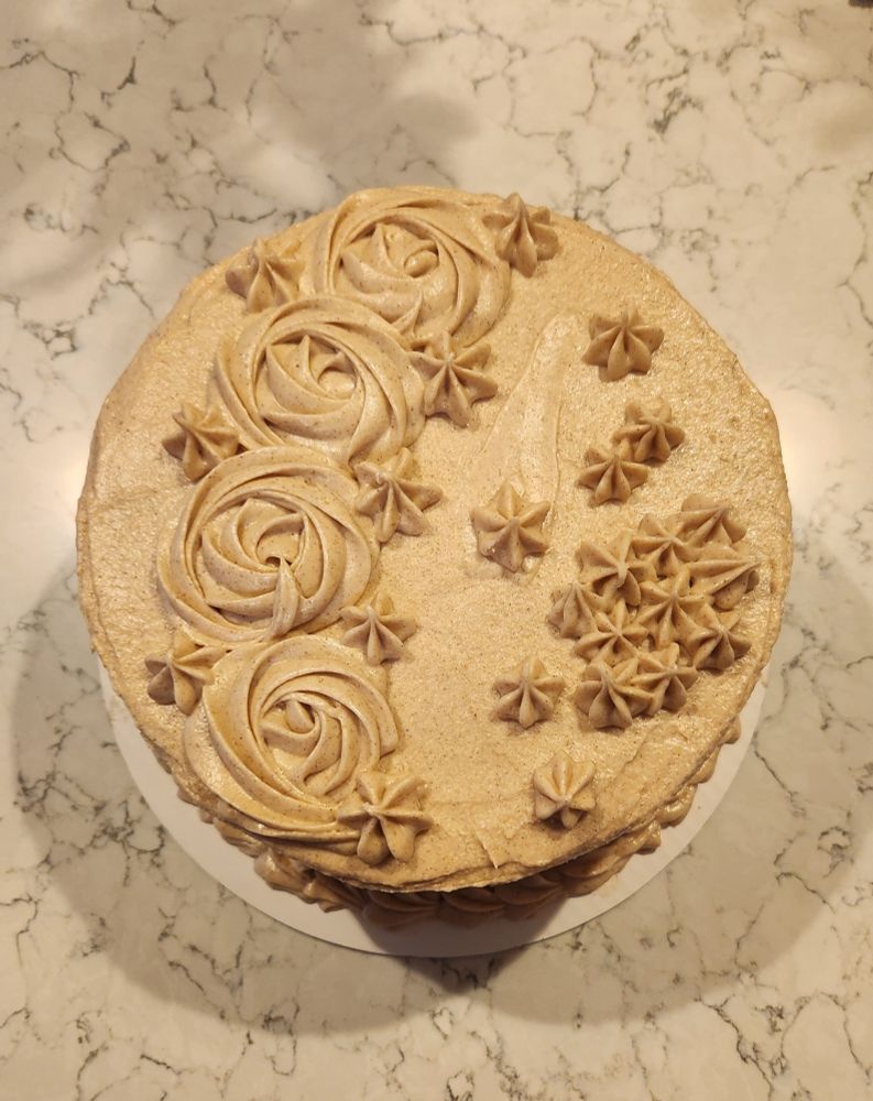 Snickerdoodle Cake with piped rosettes 