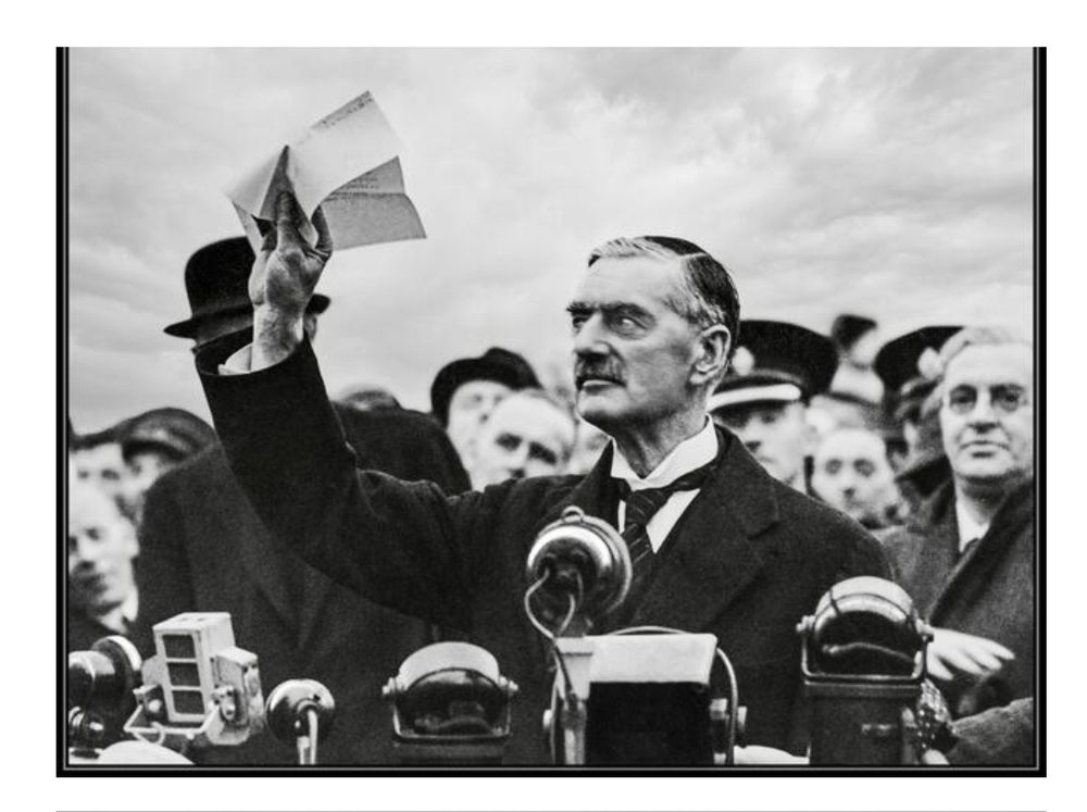 Neville Chamberlain, returning from Munich, pictured with a letter from Hitler