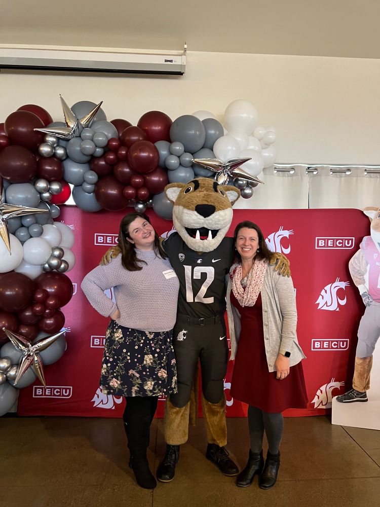 Two women with WSU mascot Butch