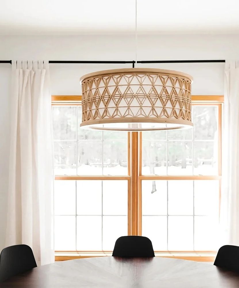 Daytime photo of the round kumiko chandelier over a dining table