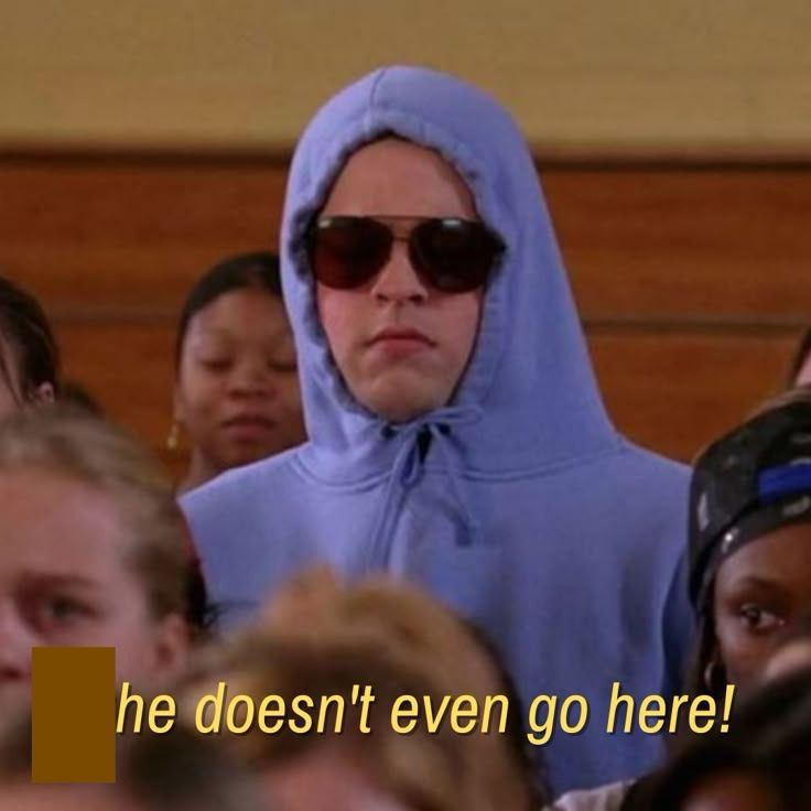 Screenshot from Mean Girls with text edited to read “he doesn’t even go here!”