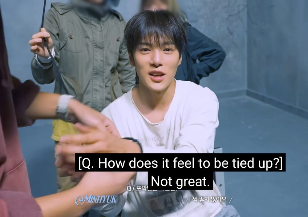minhyuk being asked how it feels to be tied up, to which is says "not great" with a cute little face