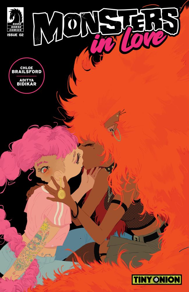 Cover for Monsters in Love #2, with what looks to be a wolf-like girl kissing a girl with another face on the back of her head!