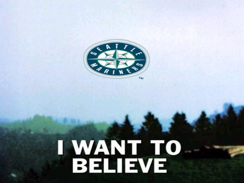 “I want to believe” UFO poster from the X-Files but instead of a UFO it’s the Seattle Mariners compass logo