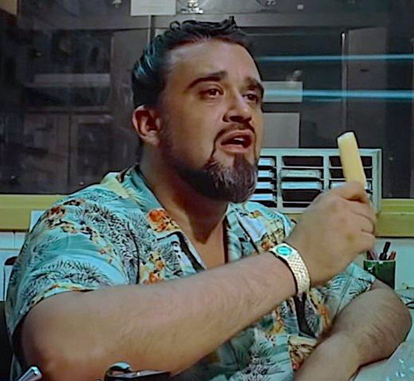 Wolfman Jack in American Graffiti eating a popsicle