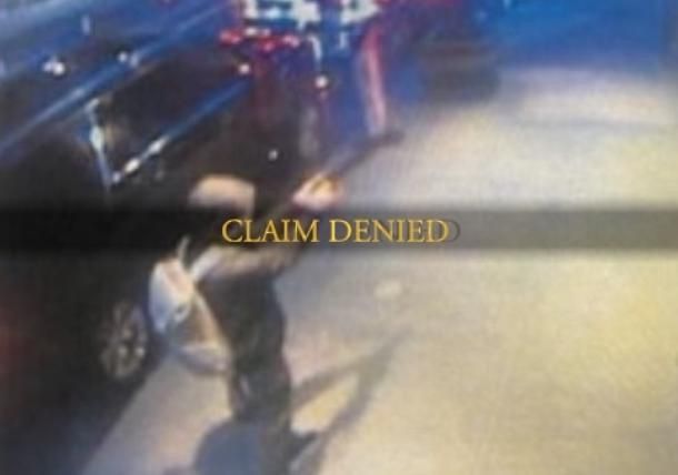 Assassin pointing a gun w/silencer, CLAIM DENIED in dark souls font overlayed