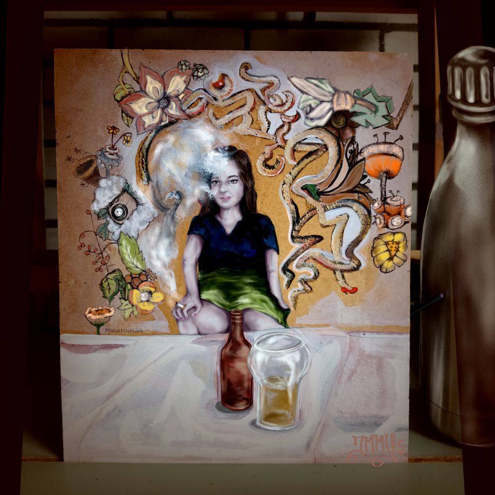 An expressionistic style painting featuring a seated girl in the center wearing a blue blouse and green skirt. She is surrounded by abstract shapes, floral motifs, and a tentacle-like figure rising like smoke. In the foreground, a brown bottle and an empty glass rest on a light surface.