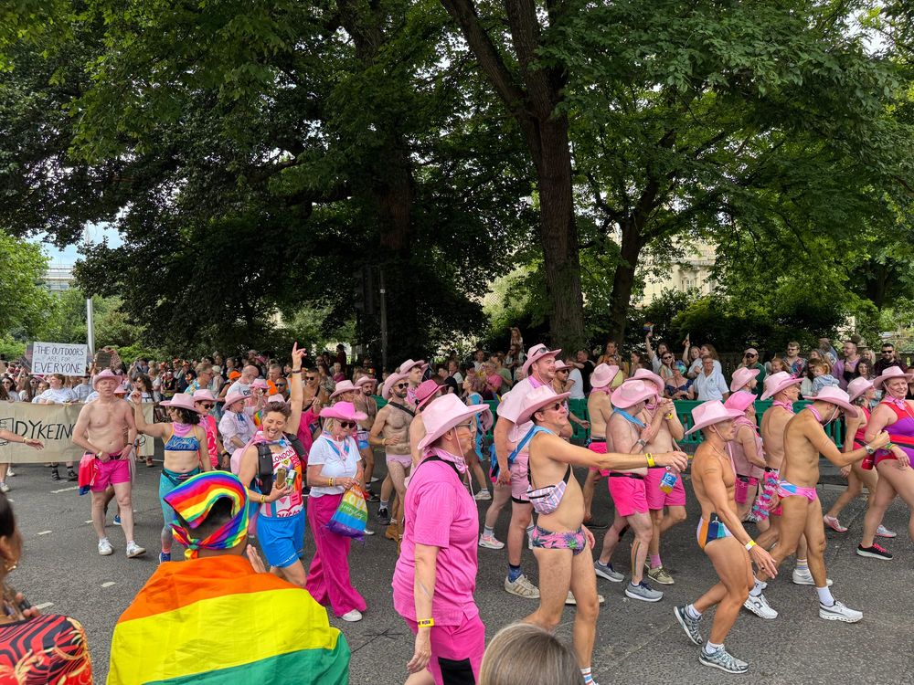 The Out swimmers in the swimming costumes and cowboy hats.