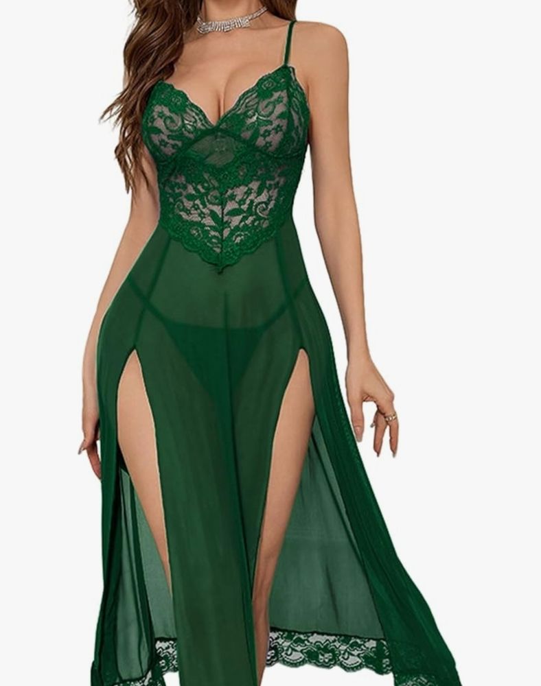 A model wearing a long green lingerie dress with a lace bodice and trim