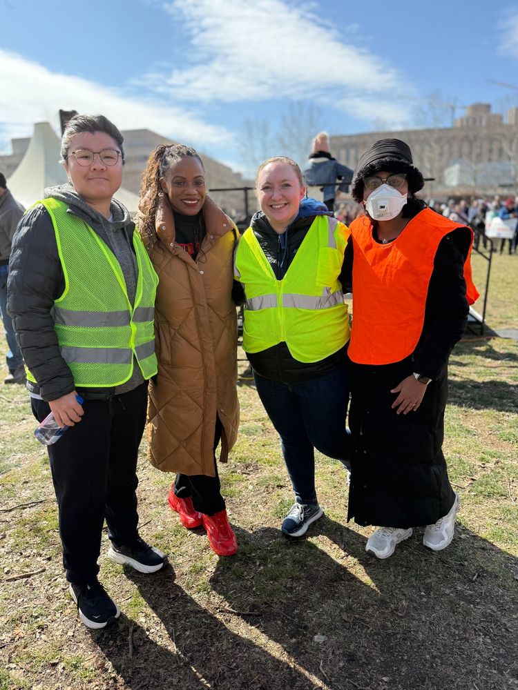 Rally organizers and Congresswoman Summer Lee smiling outside