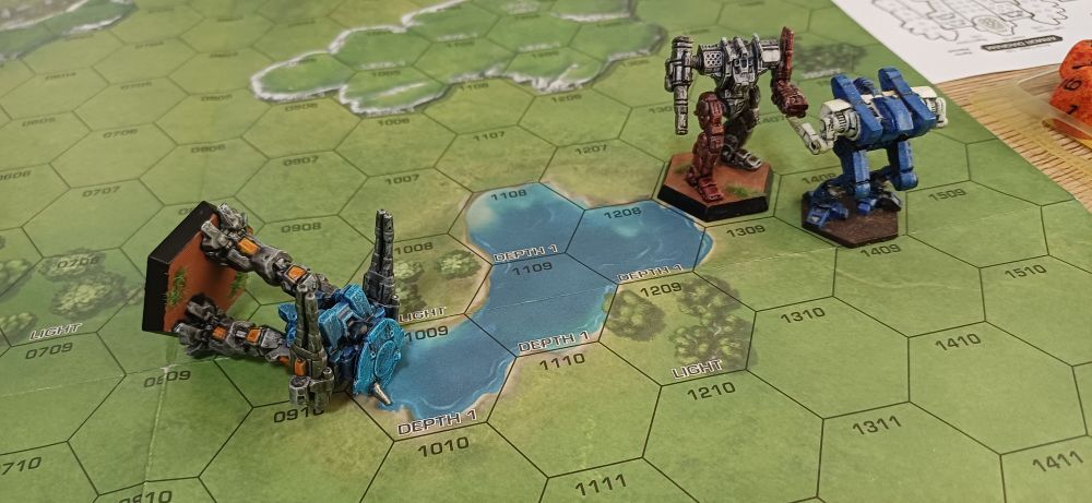 Photo: the Rifleman has been knocked down by the Highlander. The Cougar and Grendel close to exchange kicks.