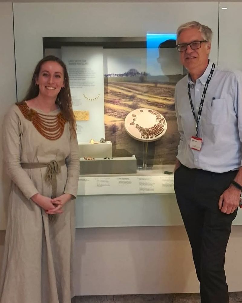 Cailtin, from wichita visiting the Amber Necklace next to museum director david dawson