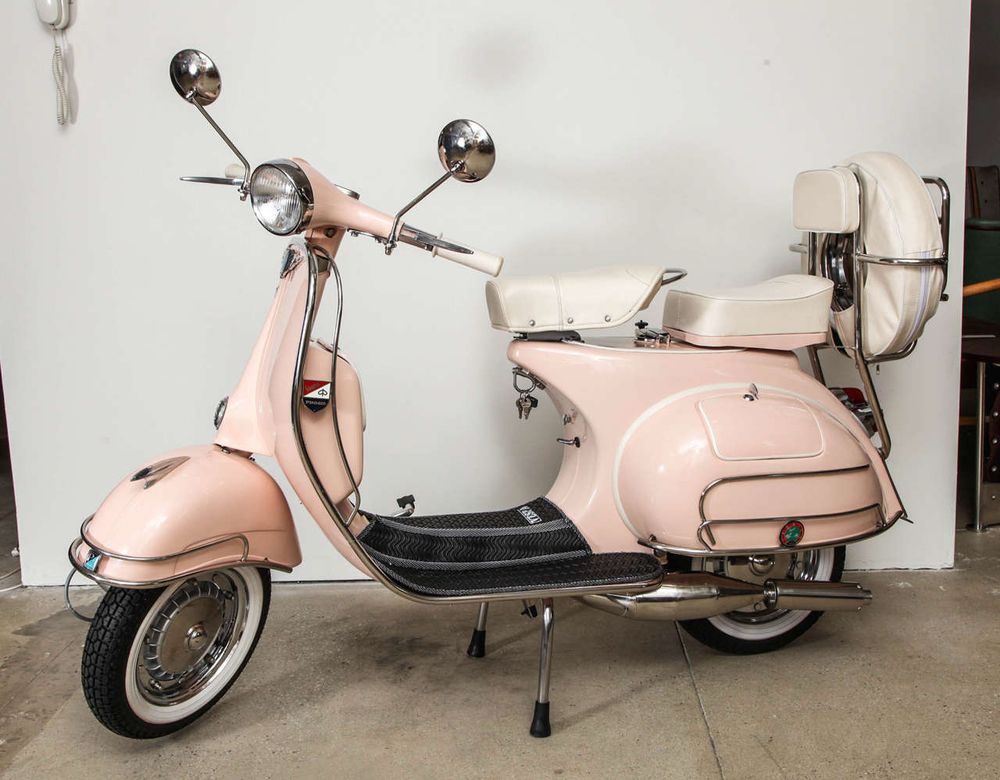 vintage pink Vespa scooter with chrome trim