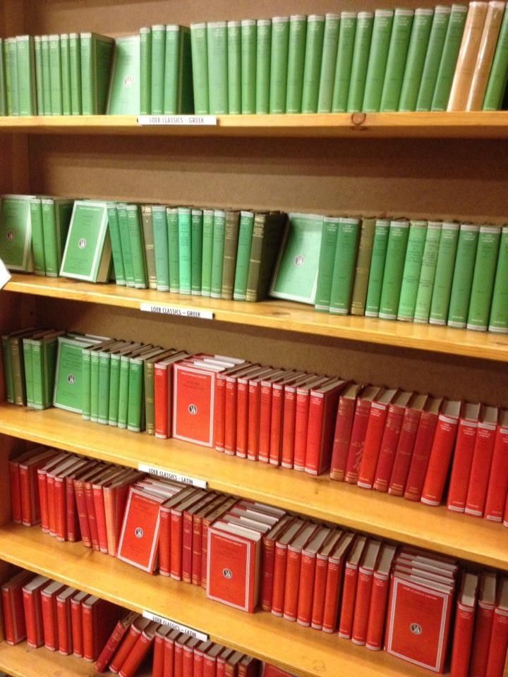 a bookcase with the Harvard classics library books… green covers are those in Greek, red for Latin 
