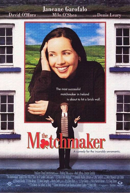 poster for the 1997 romcom The Matchmaker starring Janeane Garofalo and David O’Hara

an elderly man in a suit and striped sweater vest is standing in front of a white brick building with his arms out, palms up. an image of Janeane Garofalo is projected onto the building above him. movie tagline “the most successful matchmaker in Ireland is about to hit a brick wall”.