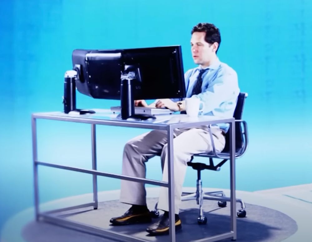 Paul Rudd at desk.