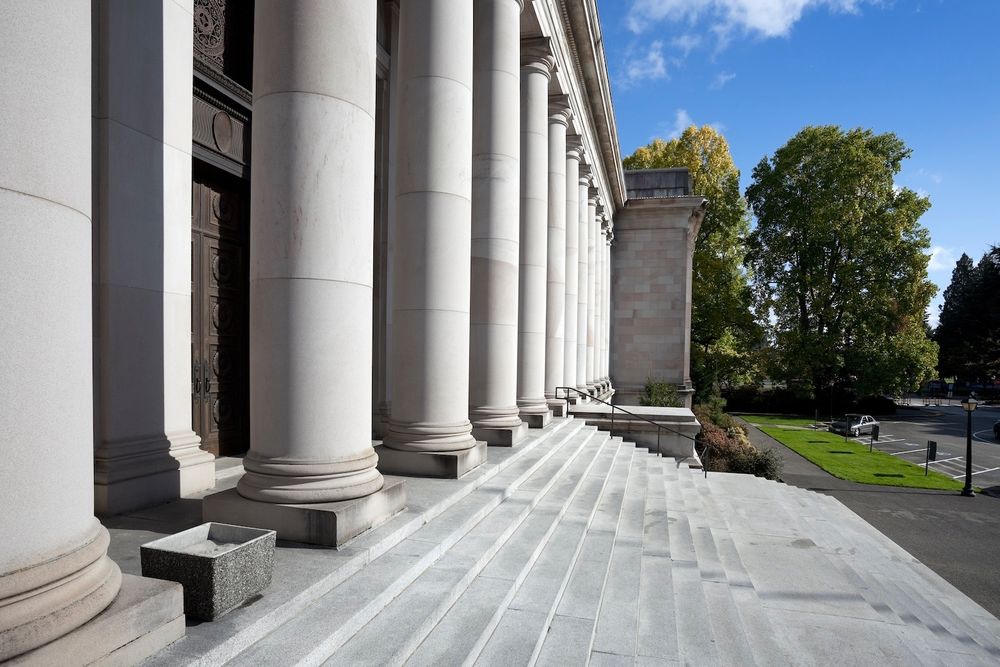 An up-close photo of steps leading up to a government building.
