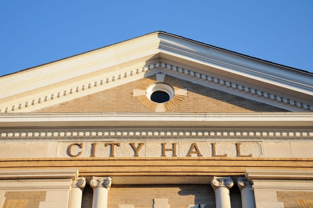 An up-close photo of a City Hall building
