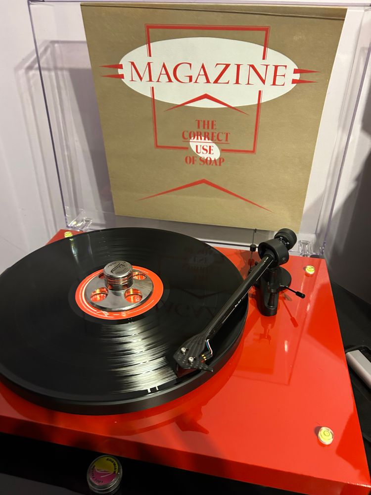 A vinyl record on a red turntable #Magazine #TheCorrectUseOfSoap