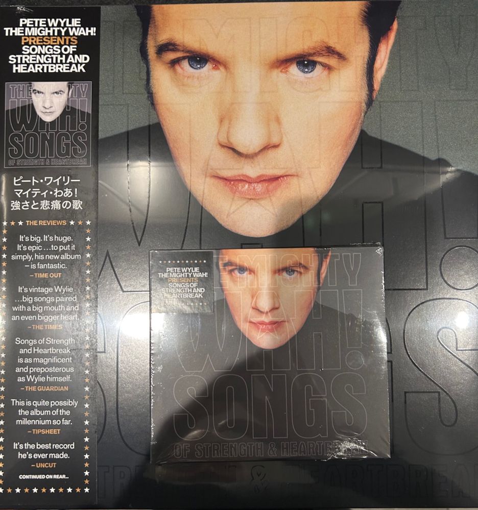 Multiple copies of Songs of Strength and Heartbreak by Wah