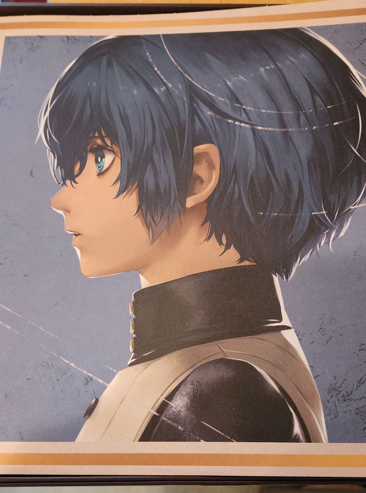 The main character of Metaphor, blue, medium length shaggy hair, blue eyes and a black and white doublet.