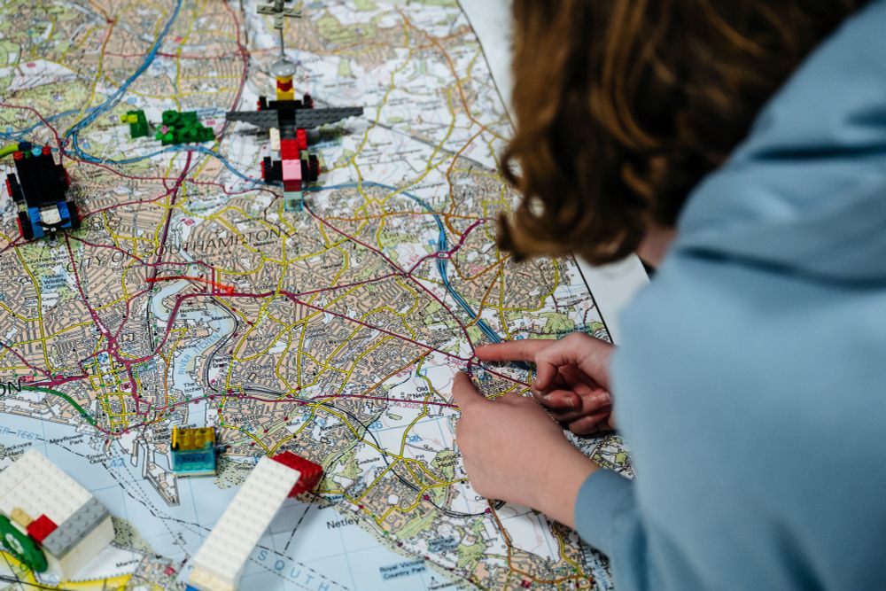Person looking down over a map.