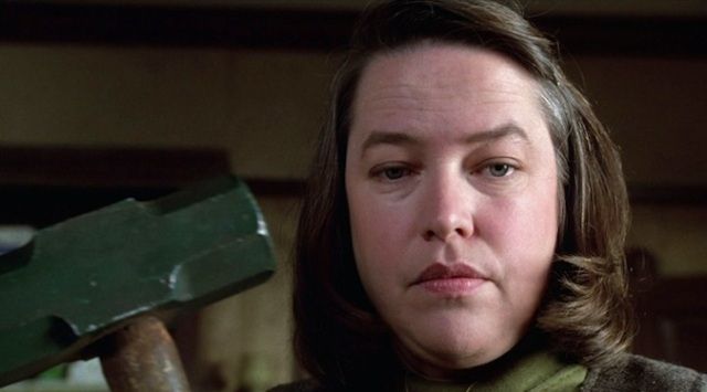 Kathy Bates holding a sledgehammer 