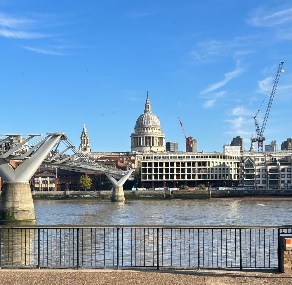 The Millennium Bridge across the Thames in London, looking northwards towards St Paul’s on a sunny day.