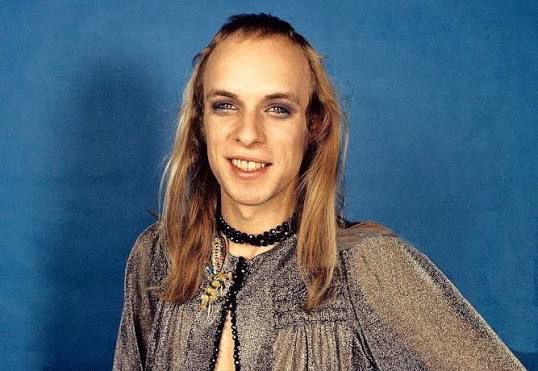 Color photo of Brian Eno circa 1970s smiling