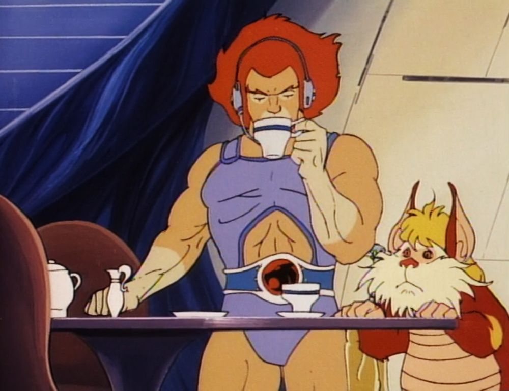 Thundercats cartoon cell of Lion-O drinking tea with headphones on while Snarf looks on.