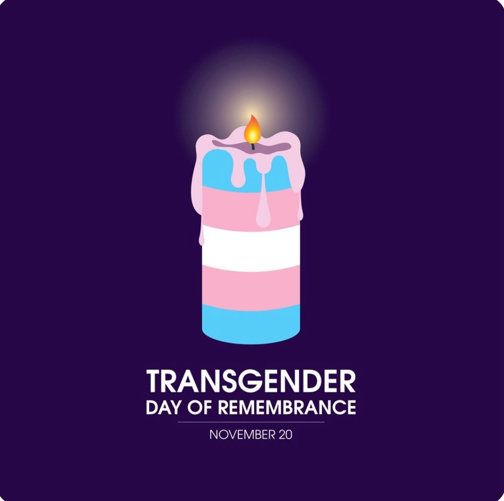 A candle with the trans pride flag is lit with a flame. The background is deep purple. Text reads “Transgender Day of Remembrance, November 20”. 
