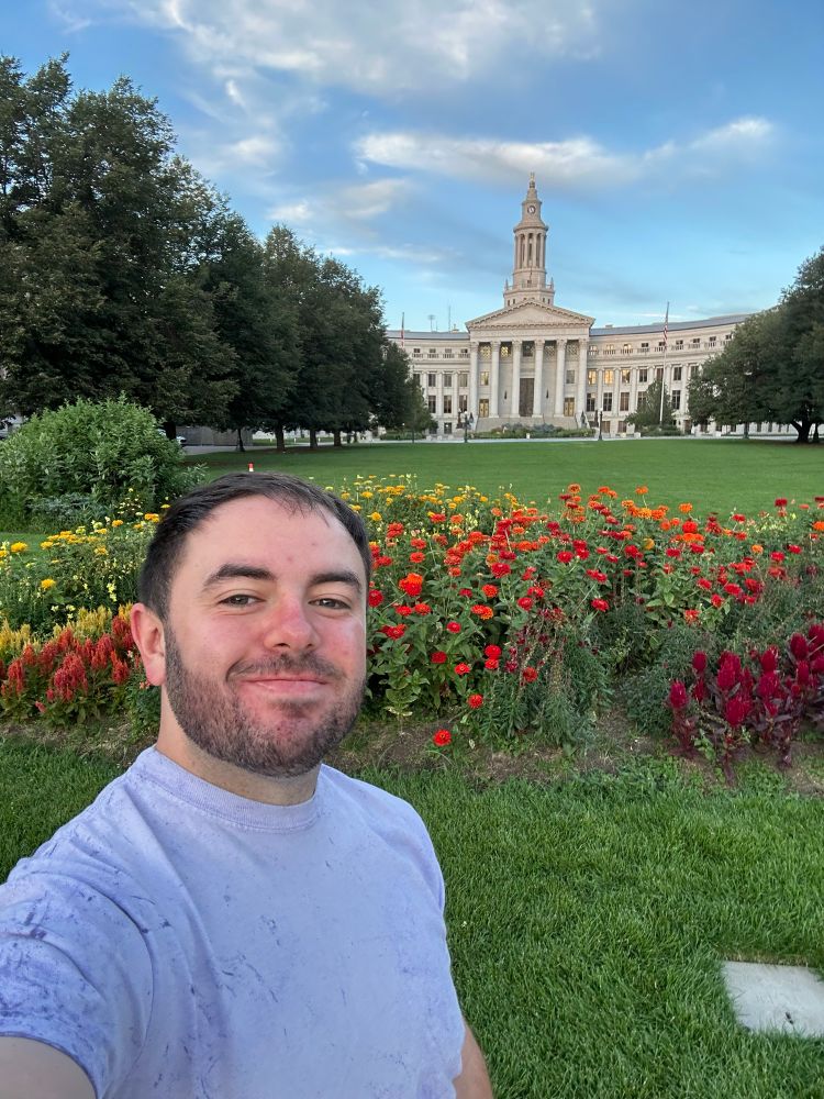 Me in front of some flowers at the capital 