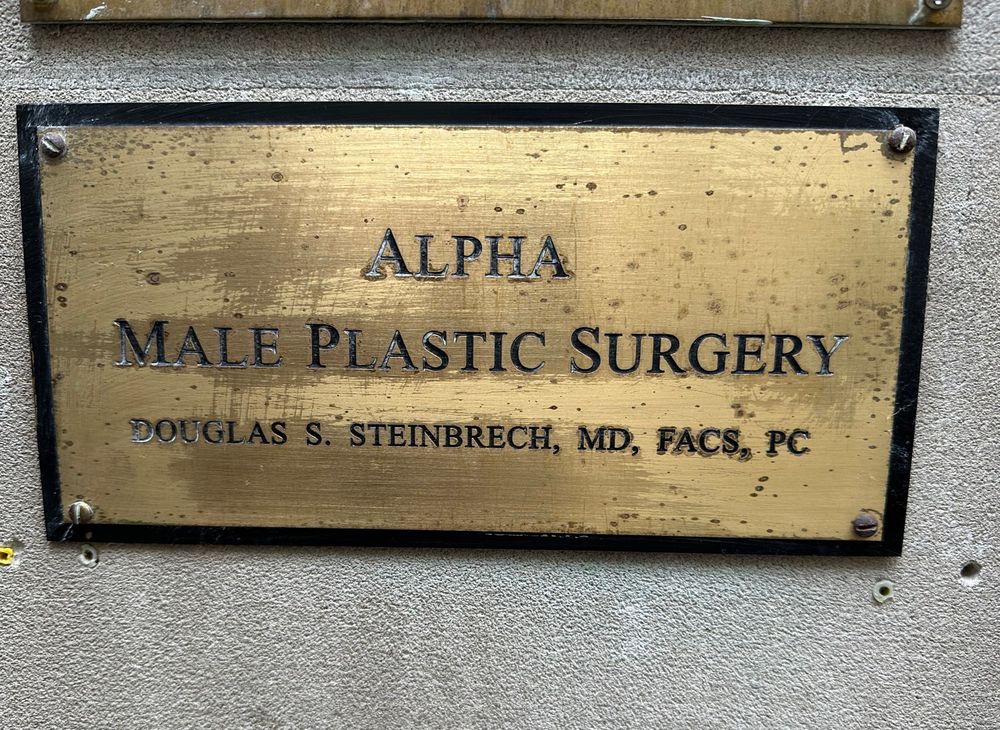 address plate says “alpha male plastic surgery”