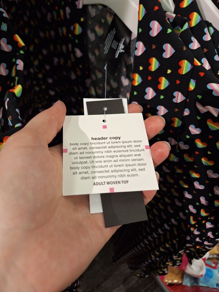 Target pride tag with "header copy" "body copy" and then lorem ipsum style filler. All of the rainbow heart shirts had this.