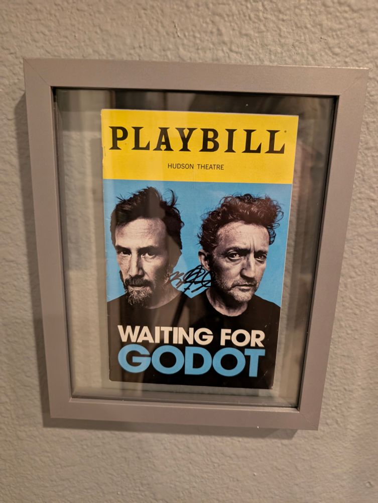 A Playbill for Waiting for Godot featuring the faces of Keanu Reeves and Alex Winter. Brandon J. Dirden has signed his initials between the two.