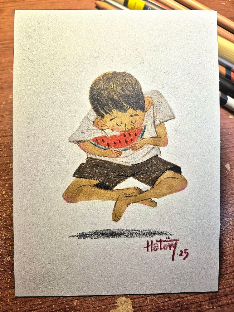 A boy eating a piece of watermelon 