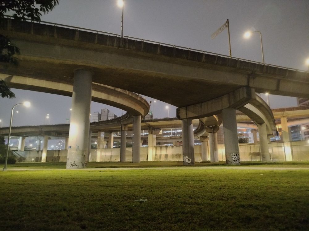 Interchange over a park at night