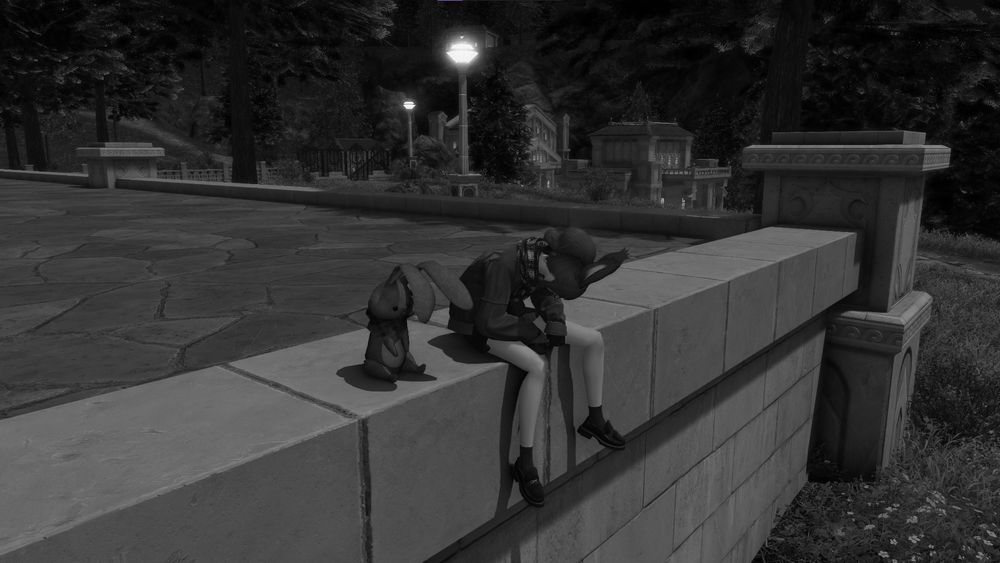 Coeli and her stuffed animal sitting on a wall looking sad and inconsolable.