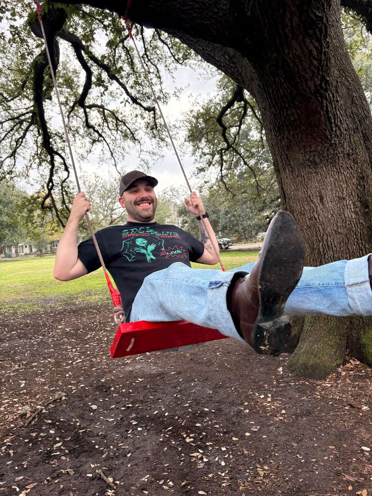 Me swinging on a red swing