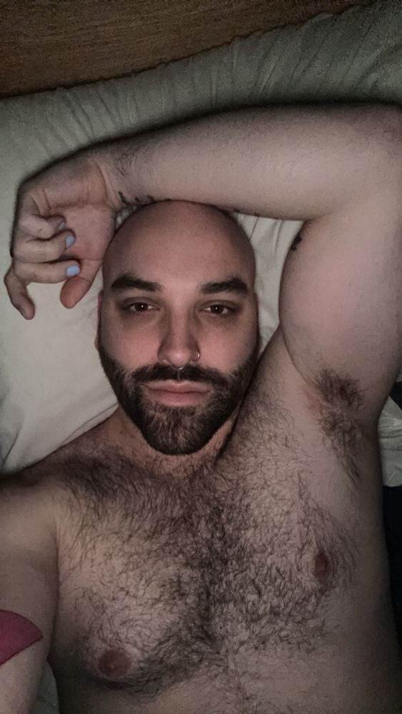 Shirtless selfie laying in bed