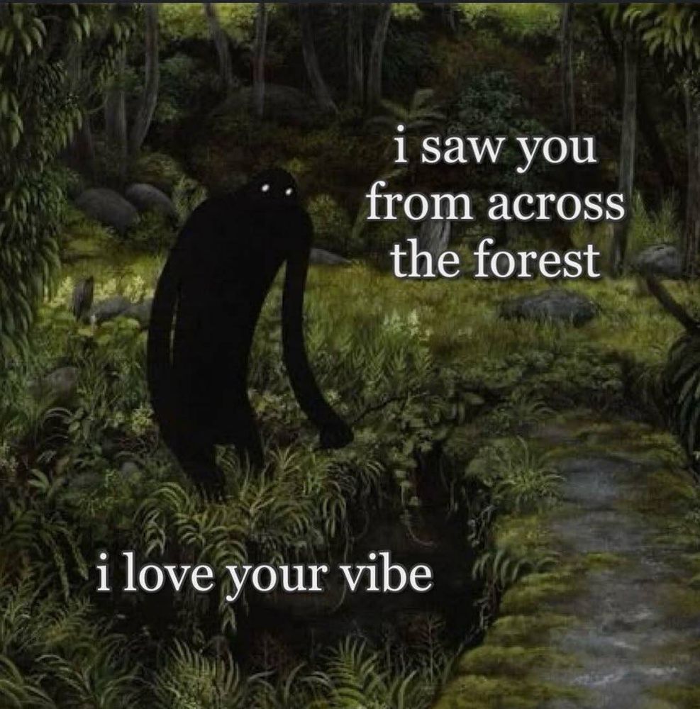 A black shadowy figure with bright white eyes standing in a forest saying “I saw you from across the forest. I love your vibe.”