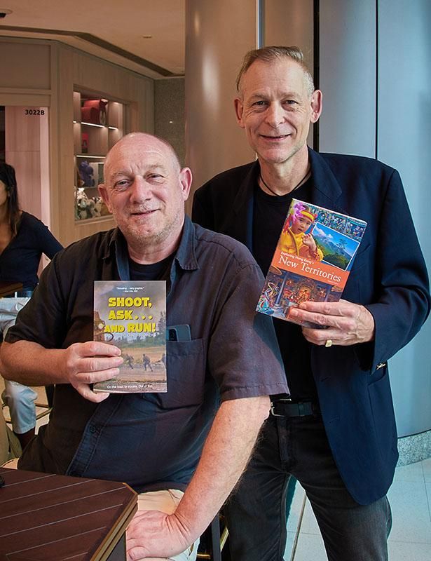 I met up with ace photo-journalist and old friend Chris Stowers for coffee a few days ago. He was in Hong Kong to promote the second volume of his memoirs, Shoot, Ask ... and Run.

Needless to say, I made sure he left with a copy of my book.