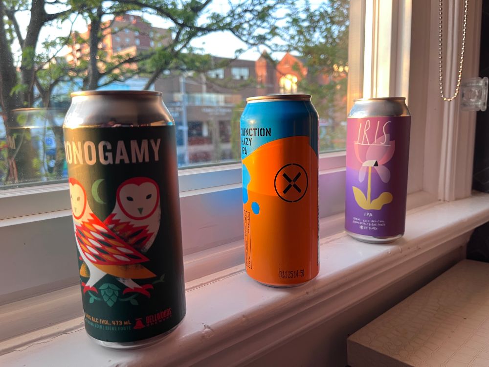 Three craft beer in early evening sun on a window ledge overlooking St. Clair W