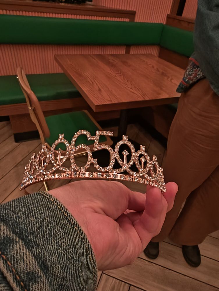 A birthday tiara that says (65)