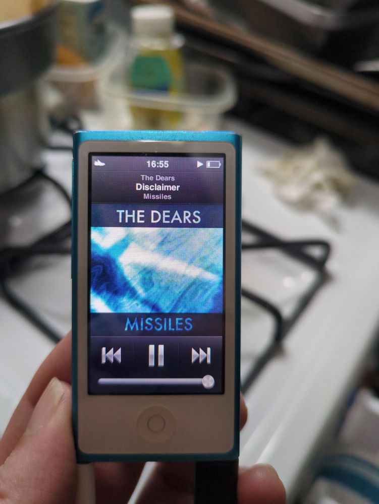A blue iPod from 2012 playing The Dears song "Disclaimer"