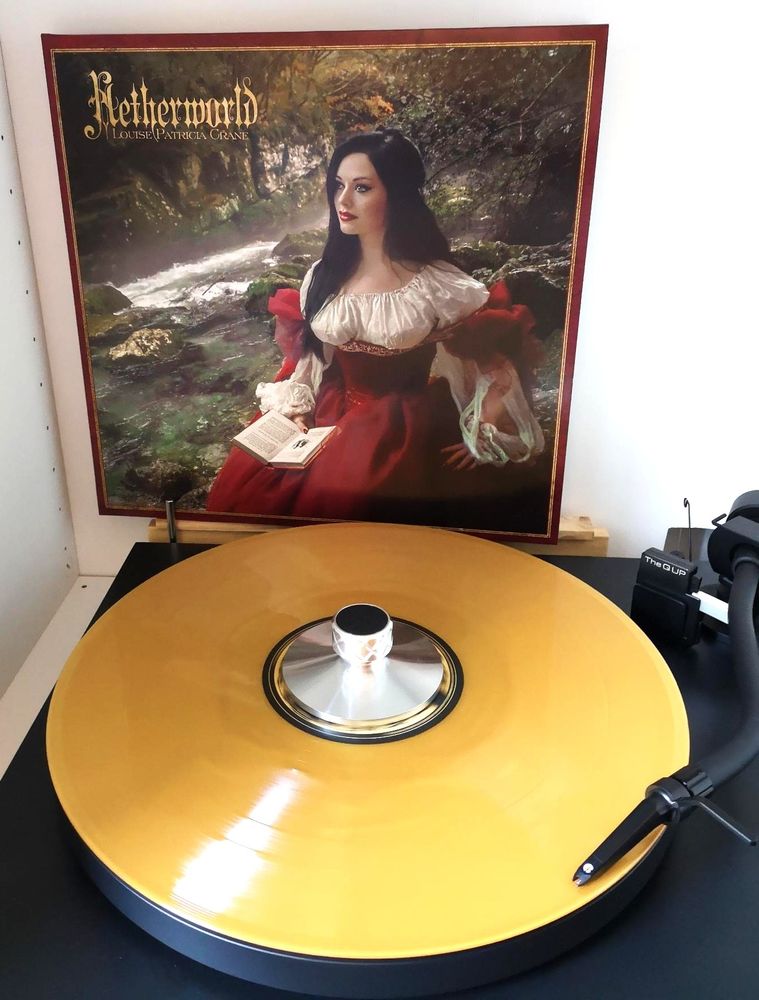 LP Netherworld by Patricia Crane. Golden Vinyl on a Black Turntable.