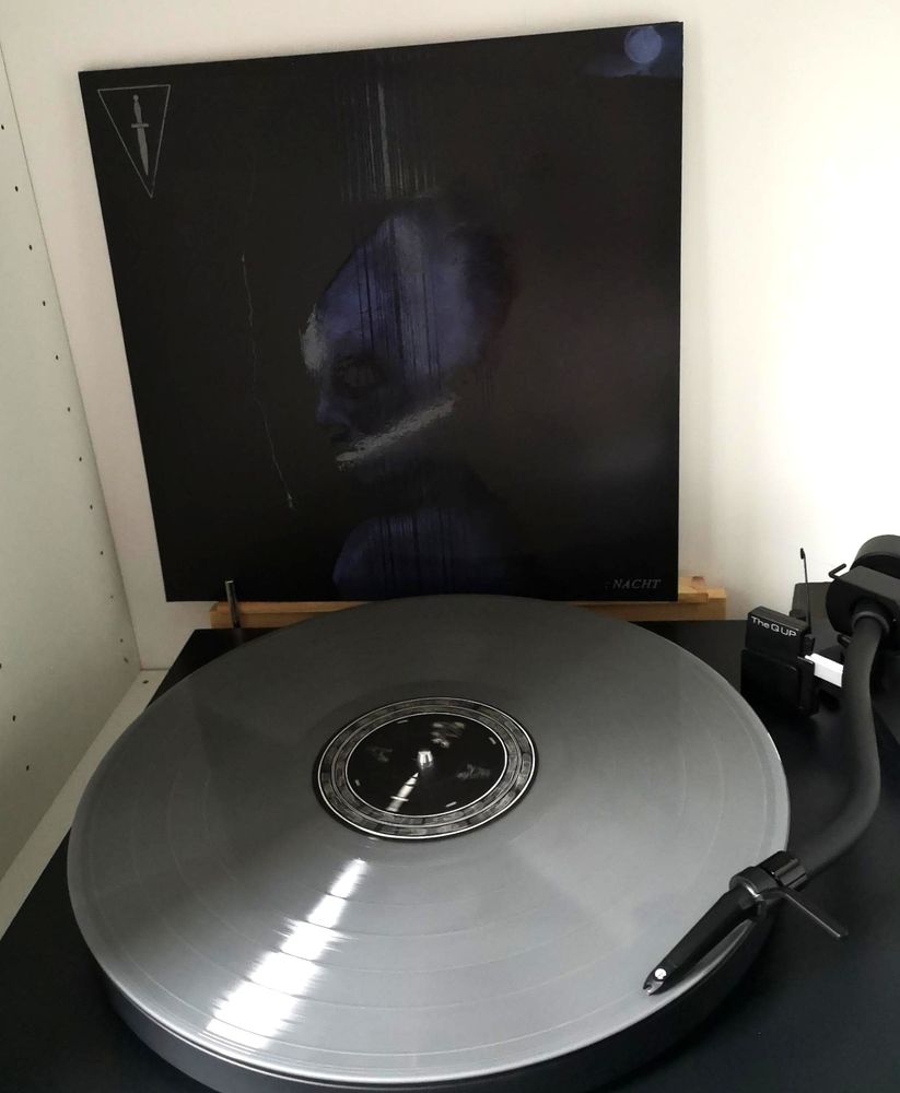 LP "Nacht" by Dolch. Silver Vinyl on a Black Turntable.