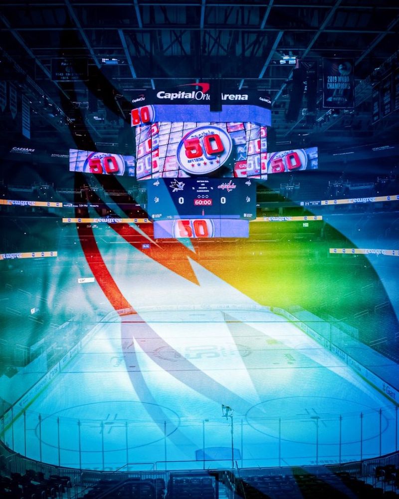 Capital One Arena ice pregame with a rainbow Weagle overlay.