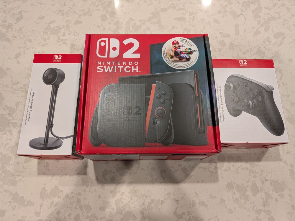 Picture of a Nintendo Switch 2 with Mario Kart World, a Switch 2 Pro Controller, and a Switch 2 Camera