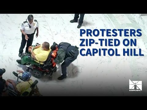 People in wheelchairs zip-tied and escorted out of Capitol during Medicaid cuts protest